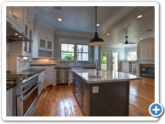 This kitchen has it all:  intricate millwork, stainless steel appliances, black granite counters, traditional yet creatively-installed subway tile.  Lots of natural light!