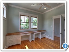 This front bedroom has been customized for the owners’ home office needs.