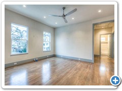 Spacious family room and hall bath at rear.  Family room features  4” plank, tongue and groove  white oak flooring.