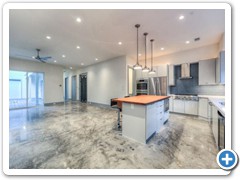 Chef’s dream kitchen w/Bosch & Thermador appliances (wine cooler included) and island.  Custom decorative iron doors w/600 lb magnetic lock to protect security, surveillance, a/v & computer equip. Door left of iron gate accesses elevator-ready shaft.