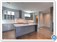 Close up of custom, site-built kitchen, featuring quartz counters and Bosch stainless steel appliances.  Very little expense is spared.