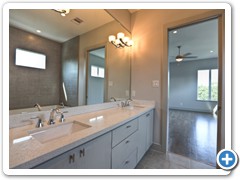  CityScape Living spares no expense to stir emotions.  Notice the custom-built double vanity with quartz counters and a mirror extending to the ceiling.