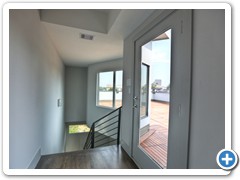 Notice not only the phenomenal view from this roof-top sanctuary, but also the take note of the genuine IPE wood tile deck surface that can be easily removed and reinstalled if and when roof repairs are necessary.